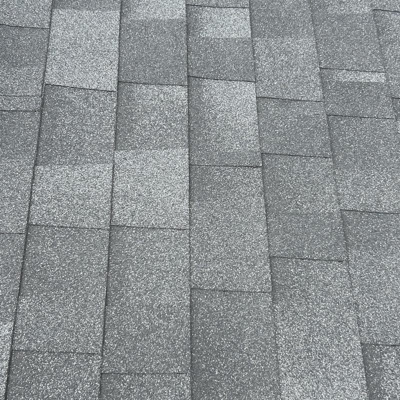 Asphalt shingle roof with a two-tone gray pattern