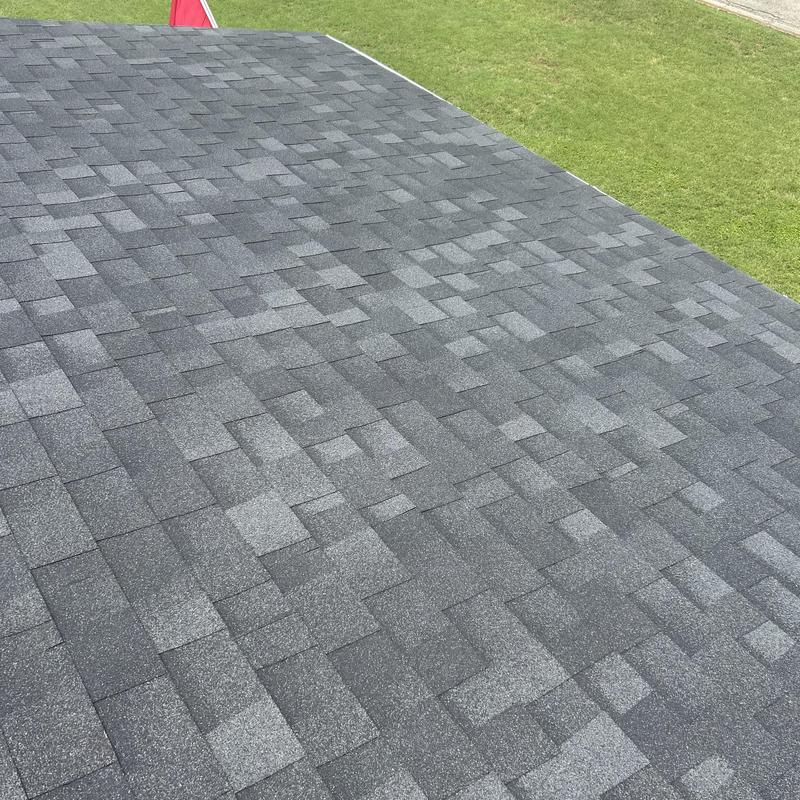 Asphalt shingle roof with black and gray tones installed