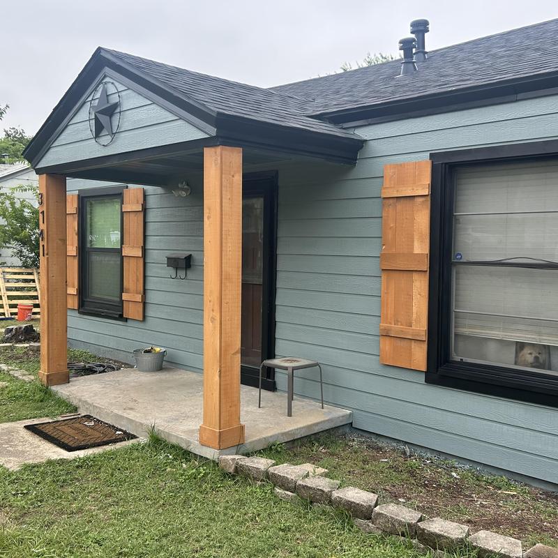Hardy backer exterior siding with wooden shutters
