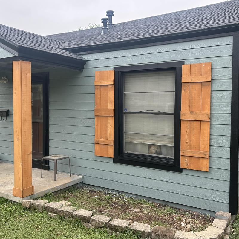 Hardy backer exterior siding with wooden shutters