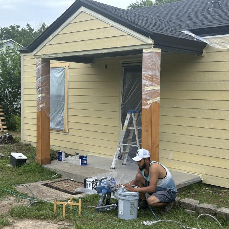 Exterior siding installation on residential porch area