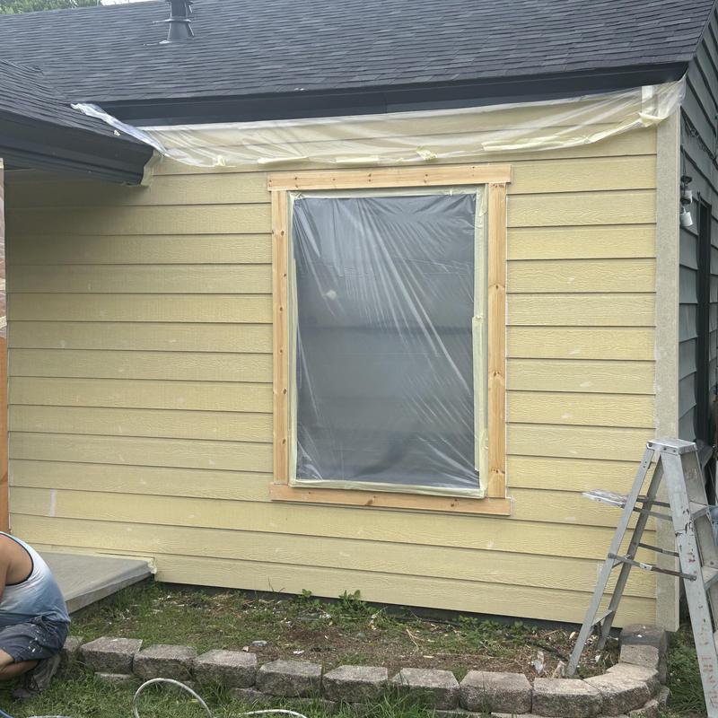 Fiber cement siding installation on house exterior