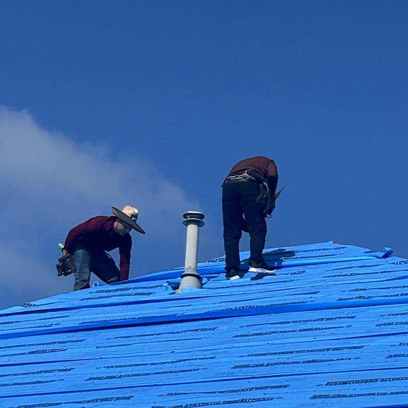 Synthetic roofing underlayment installation with chimney vent