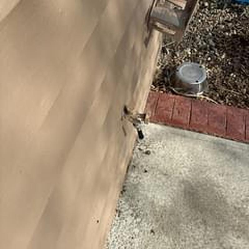 Hose bib with easy access on exterior wall