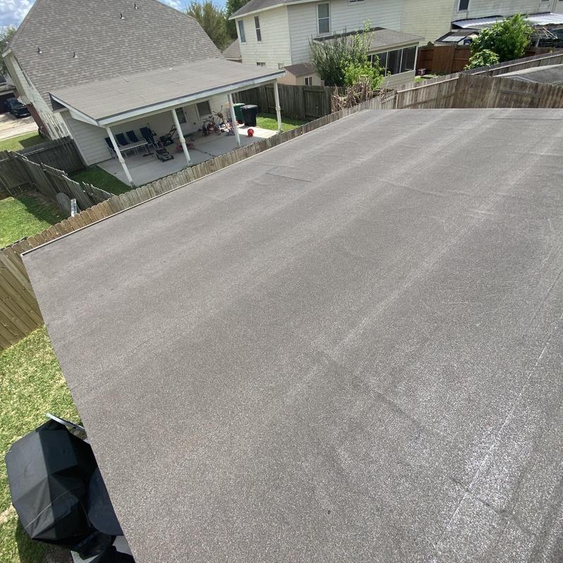 Torch down roll roofing on low-slope residential roof