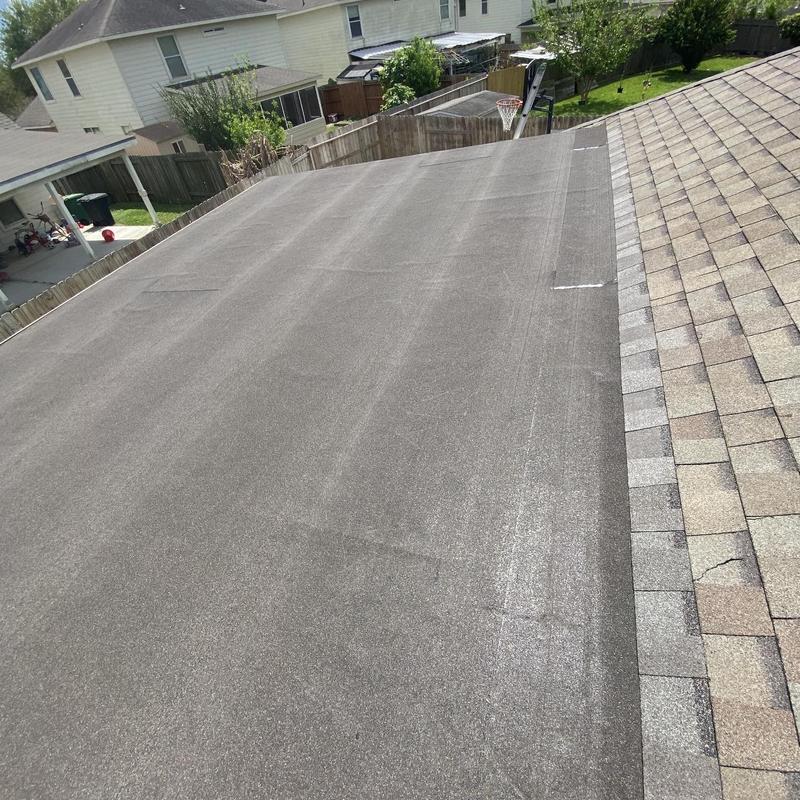 Torch down roofing membrane on flat residential roof