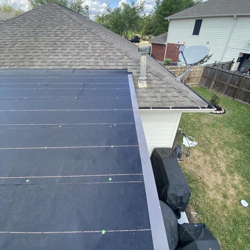 Torch down roll roofing on residential low-slope roof