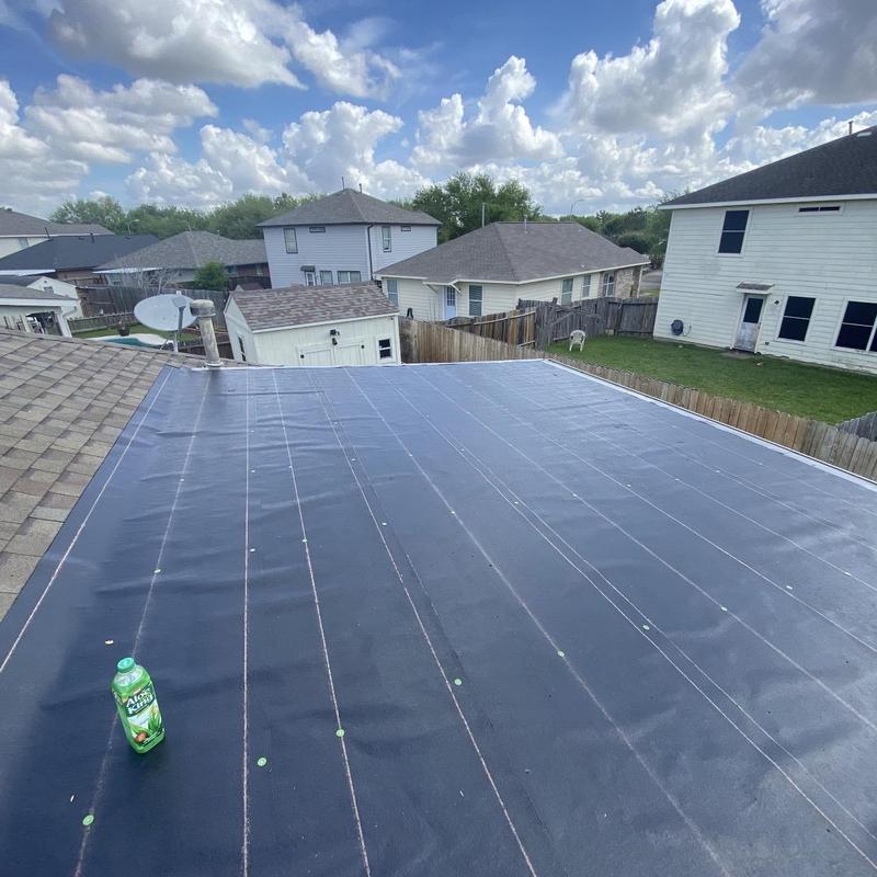 Torch down roll roofing on residential flat roof