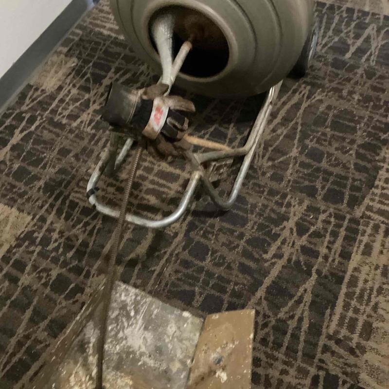 Mainline sewer cable machine at cleanout access