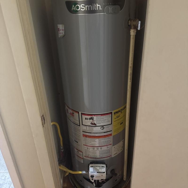 AO Smith water heater in closet with gas line