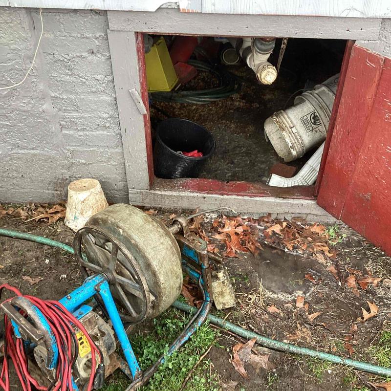 Kitchen sink drain cable fed through P-trap opening