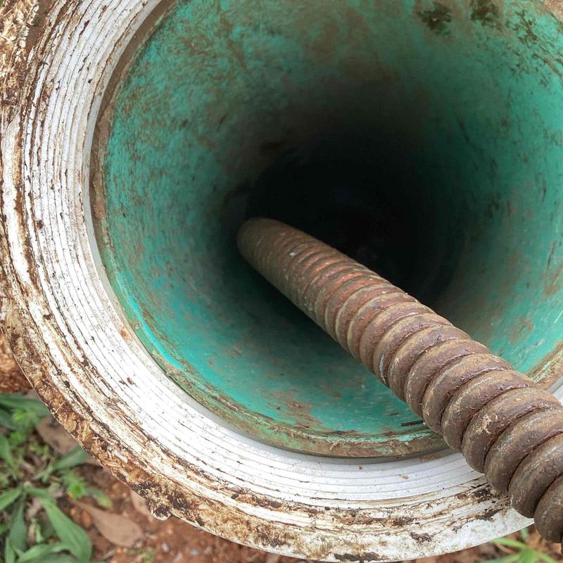 Mainline sewer pipe with cleaning cable inserted