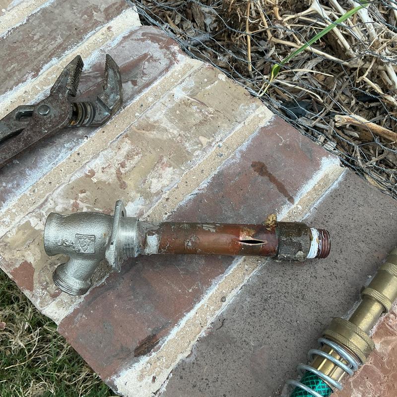 4in frost proof hose bib with pipe crack and wrench nearby