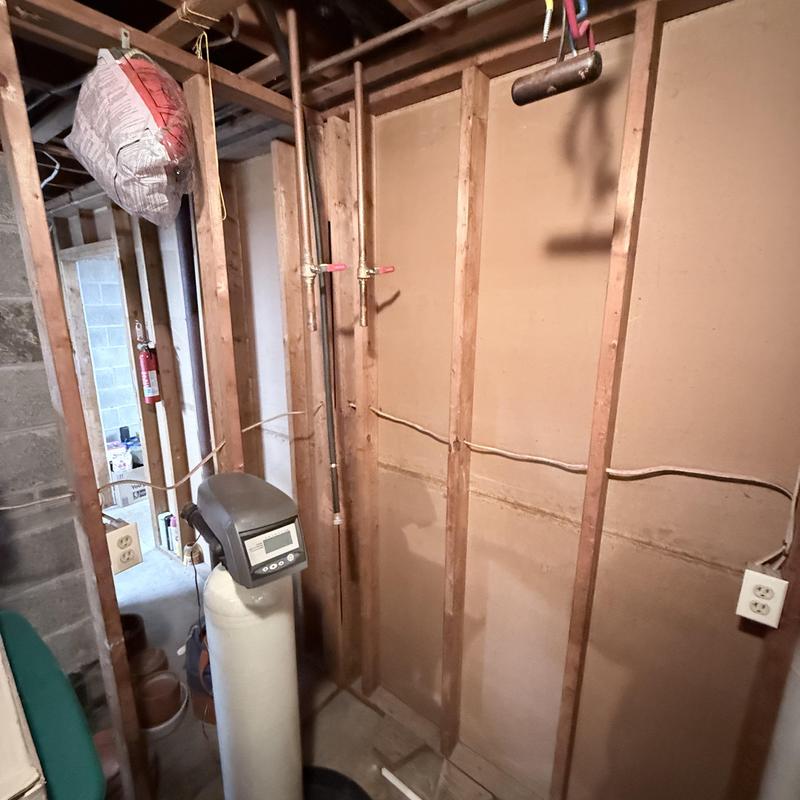 Water softener system installation in basement wall framing Water softener system installation in basement wall framing