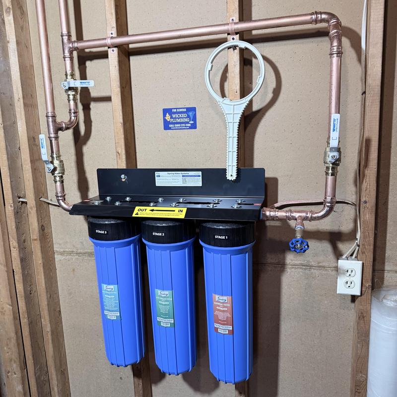 Three-stage water filtration system with copper piping Three-stage water filtration system with copper piping