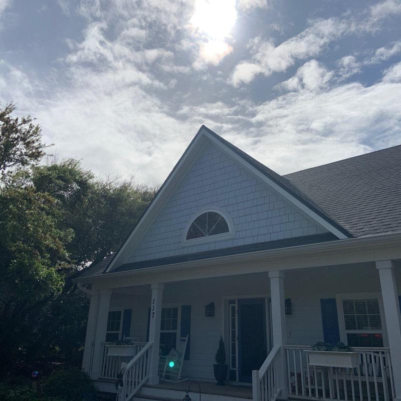 Metal roof trim on residential house roof peak