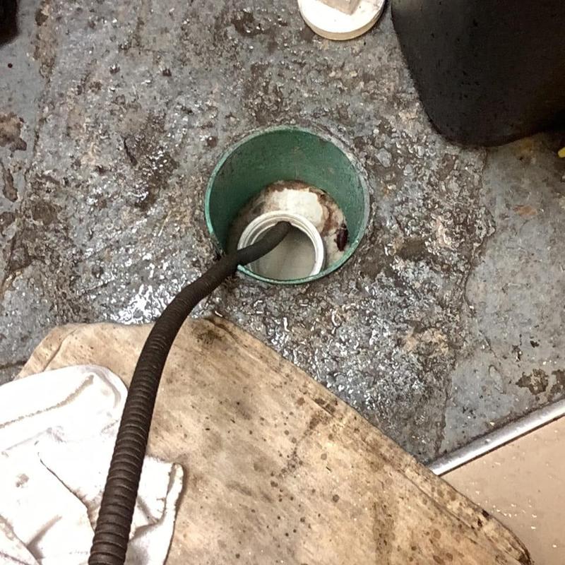 Main sewer line cleaning with drain snake tool