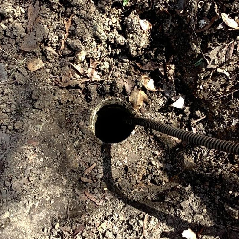 Main sewer line with inspection camera in soil
