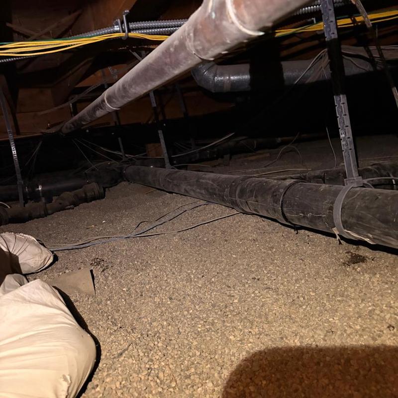 4-inch ABS drain line with pipe supports installed