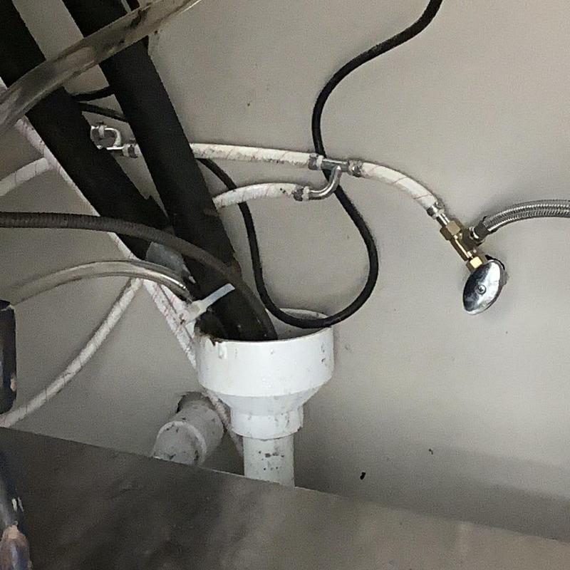 Coke machine drain line with plumbing connections