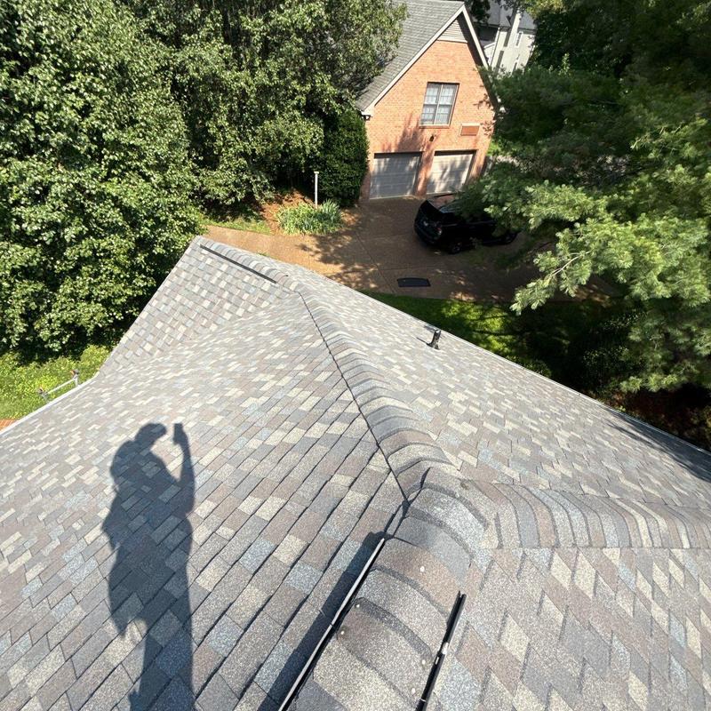 Asphalt shingle roof inspection with ridge vents and flashing