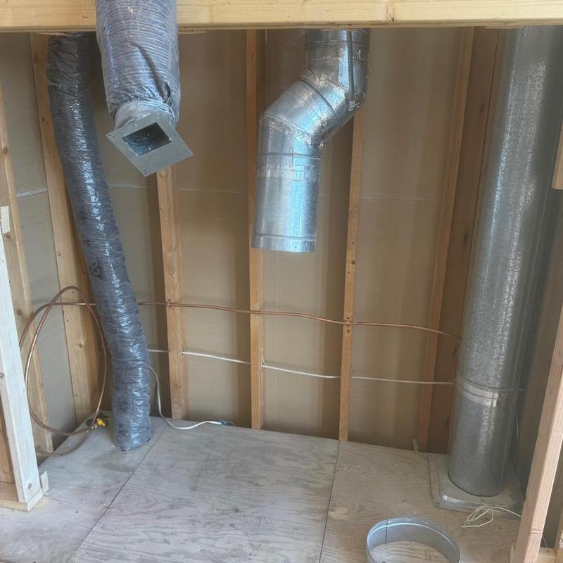 Gas lines relocated beside framed fireplace interior