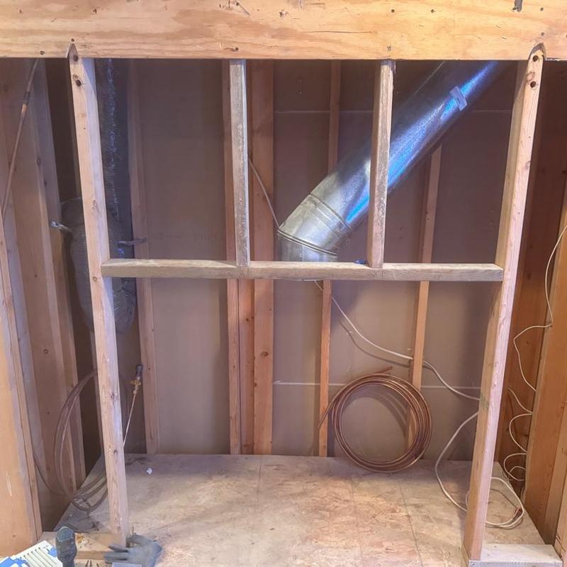 Gas line relocation beside fireplace framing