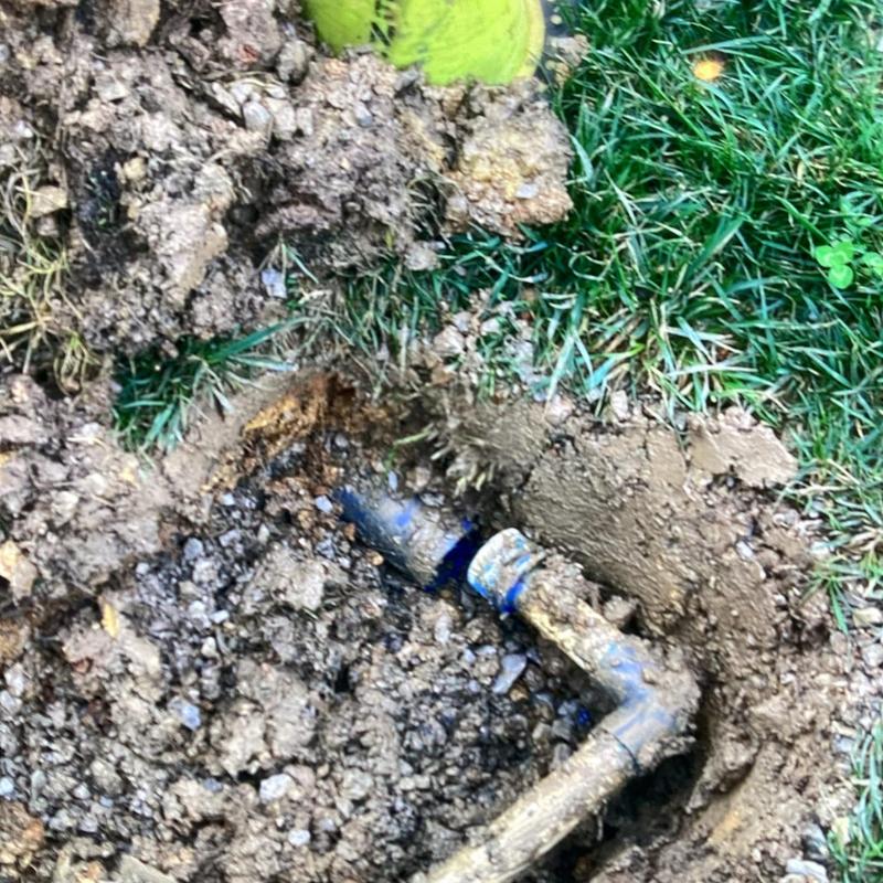 Water supply line with elbow joint buried in soil