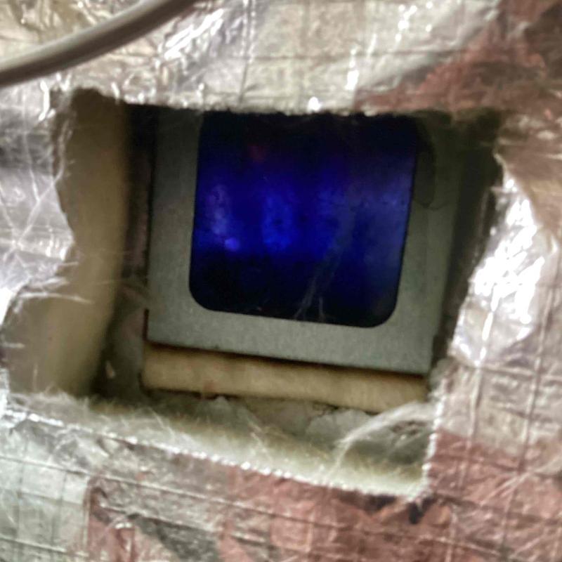 Water heater pilot light burning with blue flame