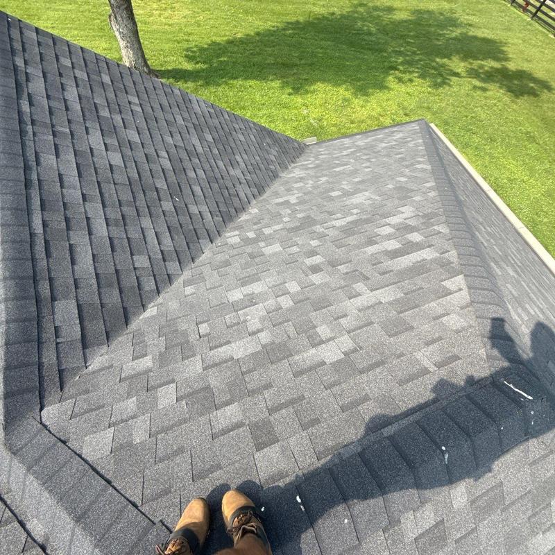 Asphalt shingle roof with hail damage inspection