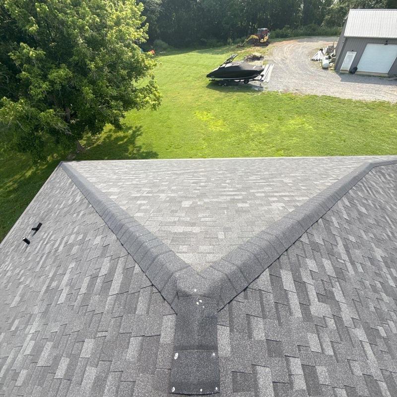 Asphalt shingle roof with ridge cap and vent flashing