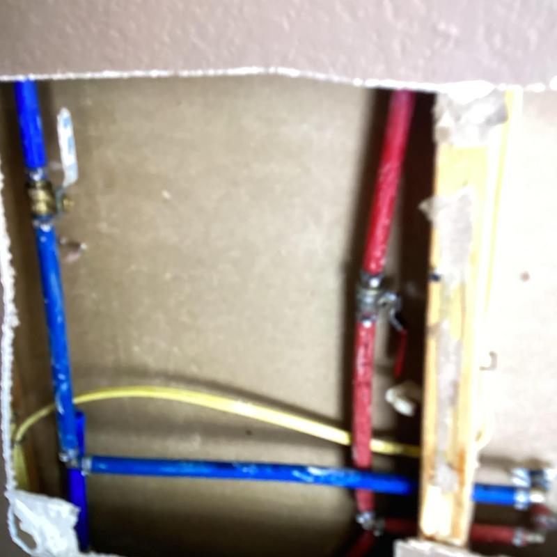 Kitchen water supply lines rerouted inside wall cavity