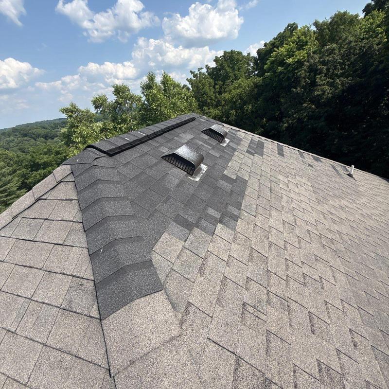 Roof shingles with new vents and ridge cap installation
