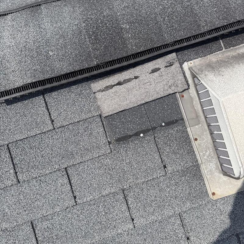Asphalt shingles roof with damaged and worn sections