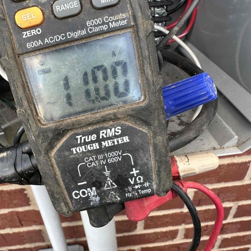 Control panel electrical clamp meter reading at 11 amps