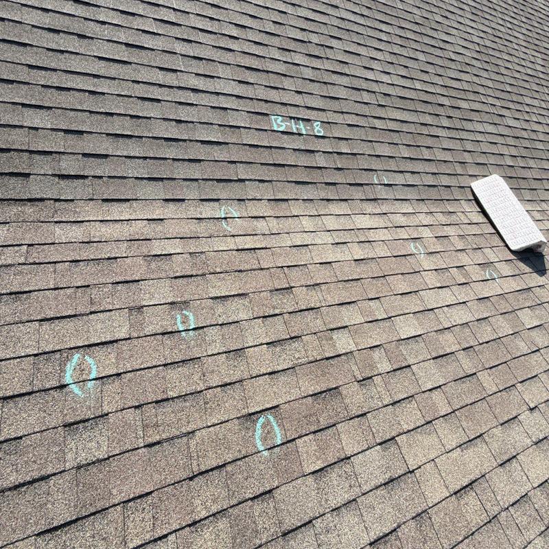 Roof shingles with hail damage markings