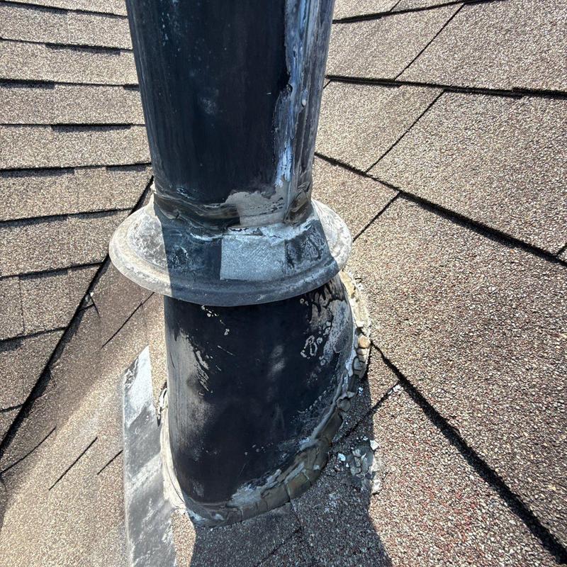 Roof pipe flashing with hail damage on shingles