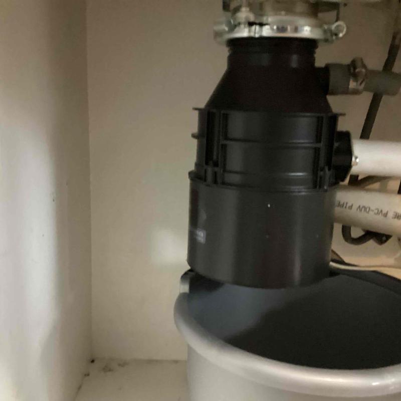 Garbage disposal unit replacement under sink plumbing
