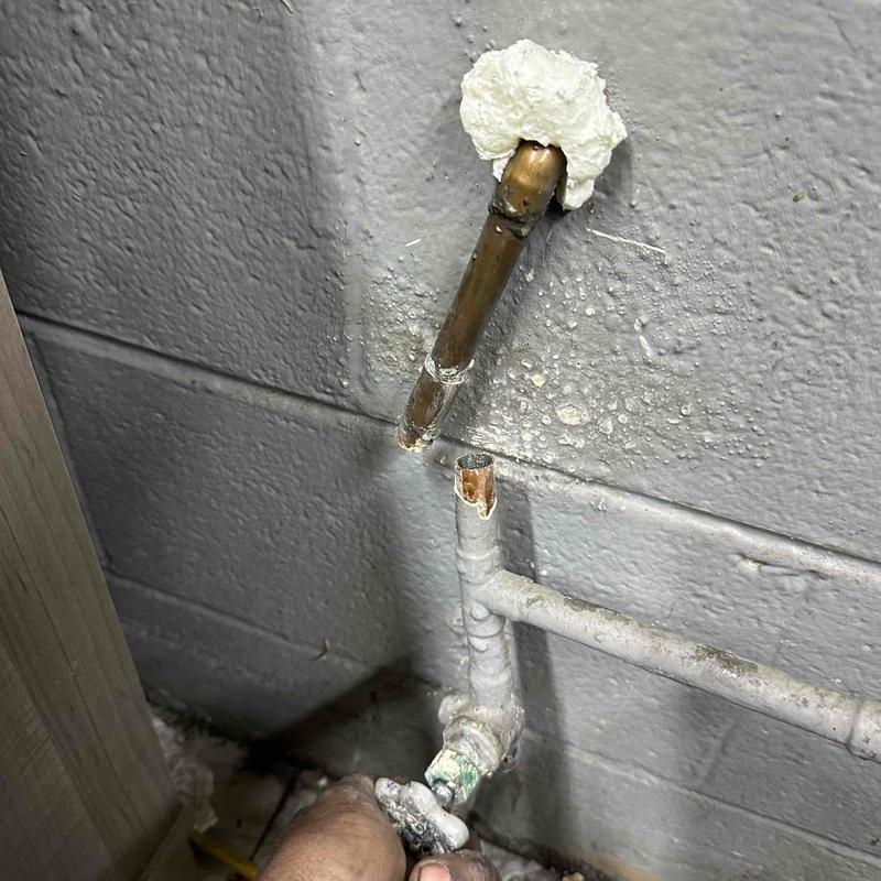 Copper shut-off valve leaking behind office wall
