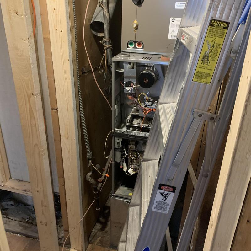 Furnace inducer motor with ladder in utility space