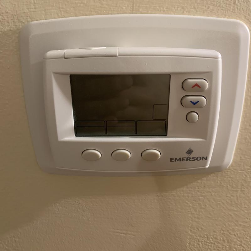 Emerson thermostat on wall with non-functioning display