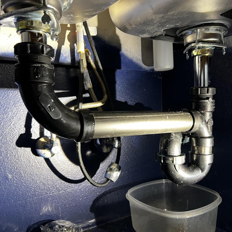 Kitchen sink ABS drain plumbing with P-trap installation Kitchen sink ABS drain plumbing with P-trap installation