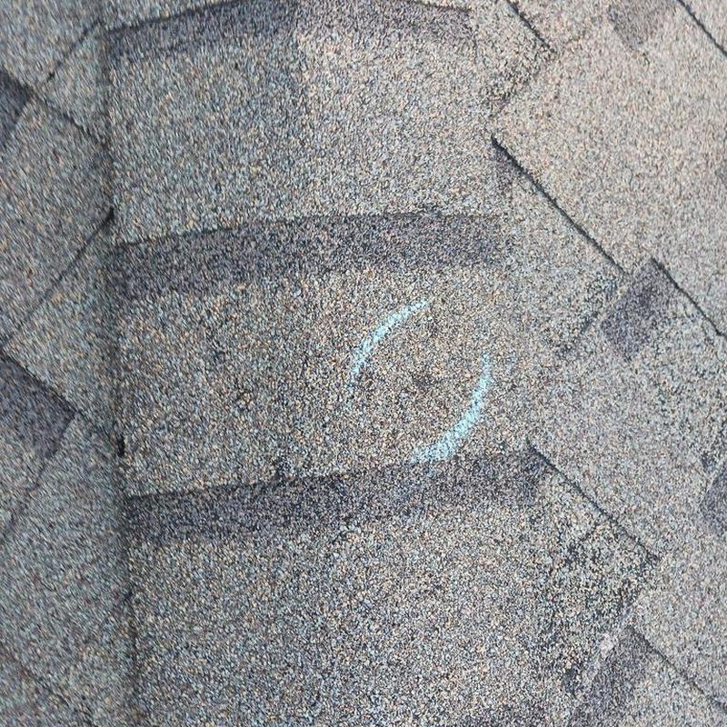 Asphalt roof shingles with chalk damage marking
