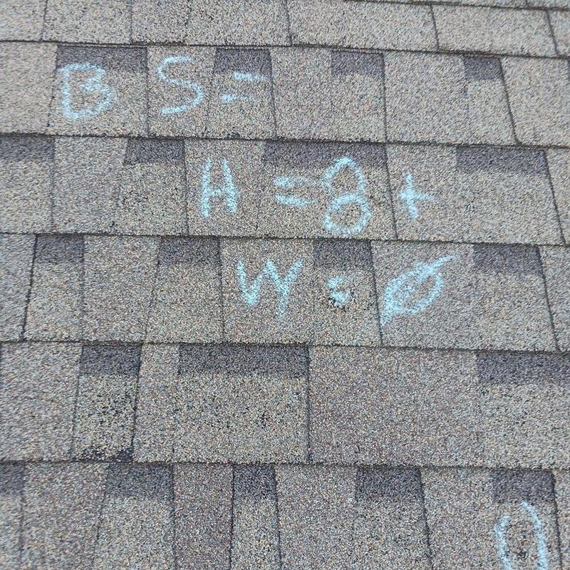 Asphalt roof shingles with chalk inspection markings