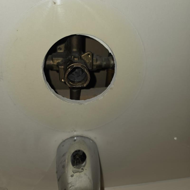 Moen Posi Temp cartridge valve housing in tub wall