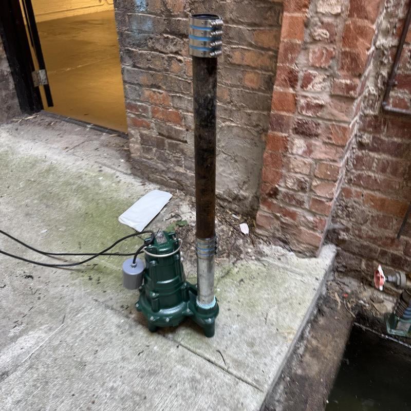 Zoeller sump pump with updated discharge pipe