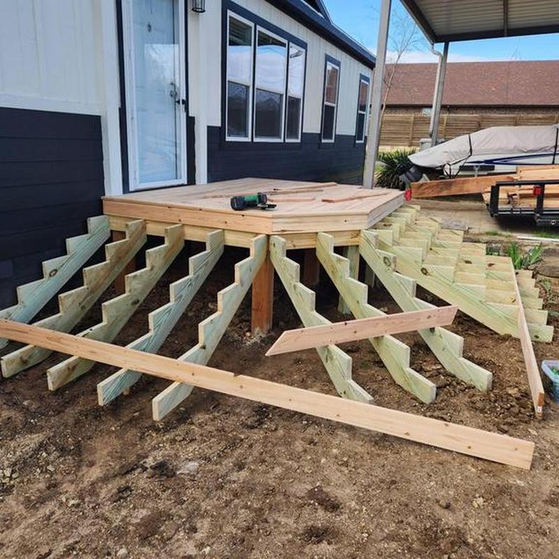 Wooden porch foundation framing installation in progress