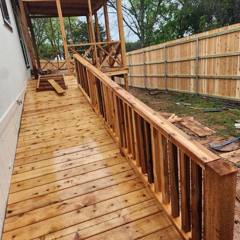 Wooden front porch deck and railing construction