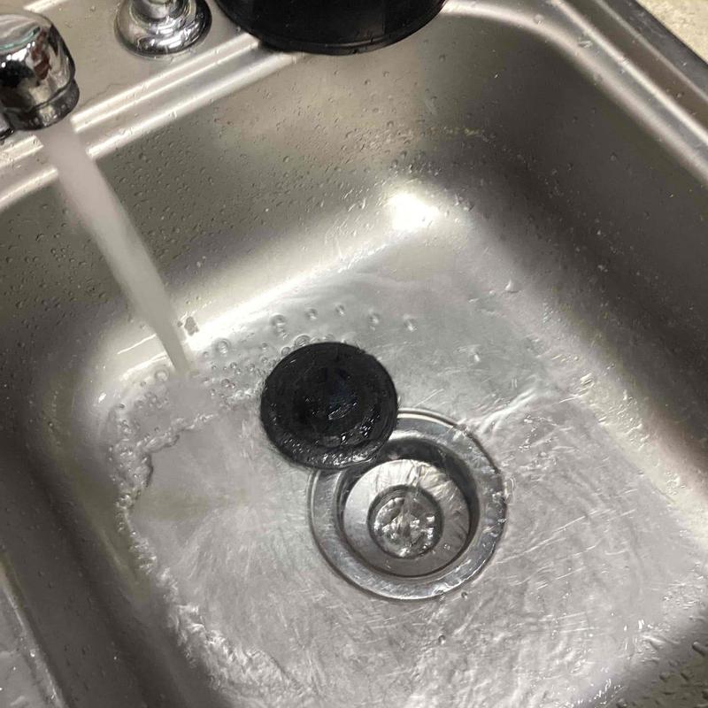 Kitchen sink drain with water running and stopper removed