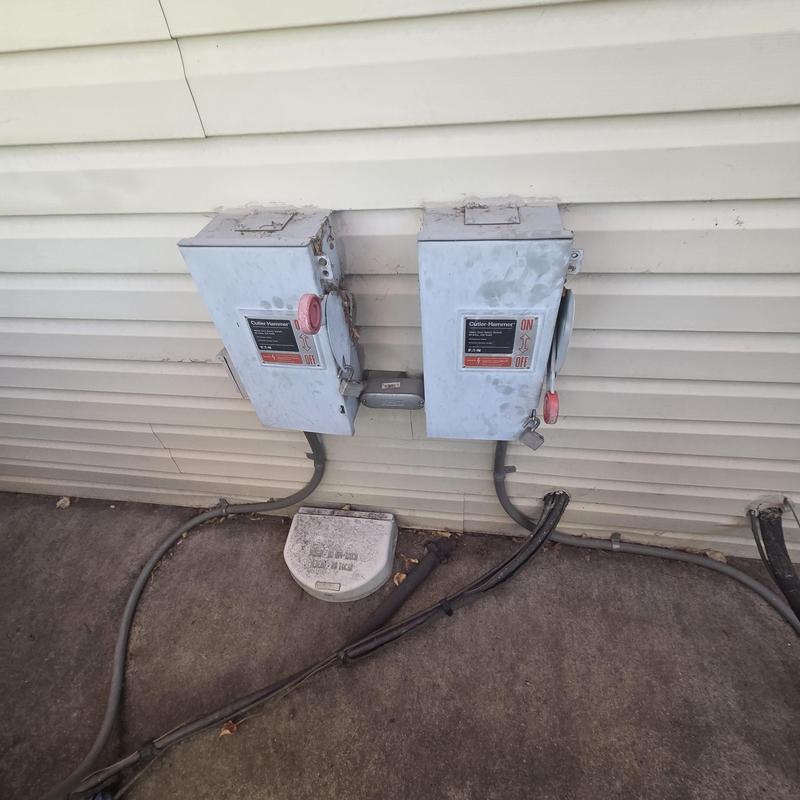 HVAC Disconnect Boxes on Building Exterior Wall